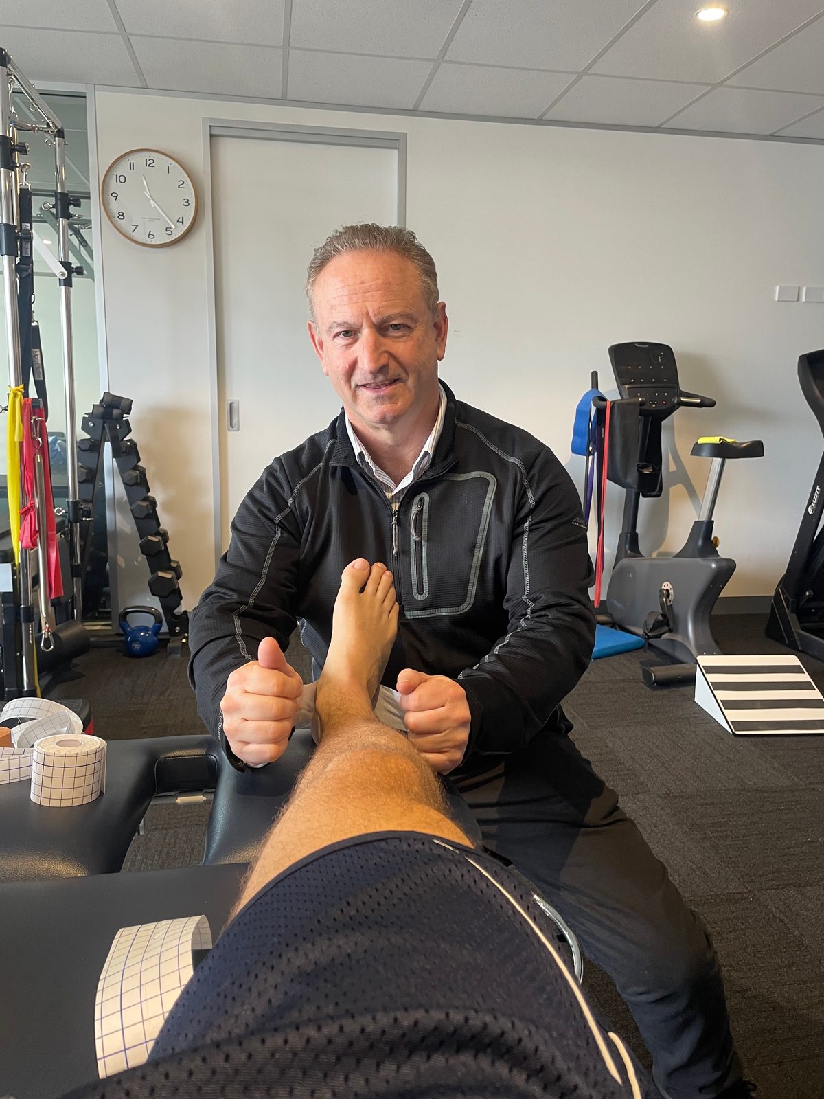 Seth Hirschowitz performing physiotherapy treatment on a patient